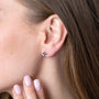 Budded Cross Stud Earrings in 925 Sterling Silver – shown worn