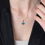 Dove Pendant Necklace in 925 Sterling Silver, Green-Blue Enamel – shown worn, close-up
