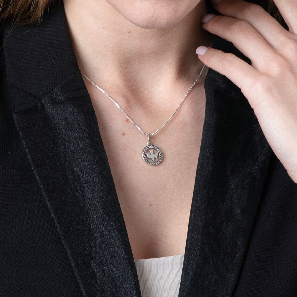 Round Dove Pendant Necklace in 925 Sterling Silver, Beaded Border – shown worn, close-up