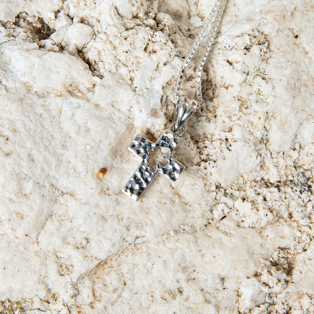 Hammered Cross with Cutout Dove Pendant Necklace in 925 Sterling Silver – flat lay