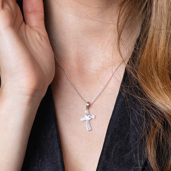 Wavy Cross and Dove Pendant Necklace in 925 Sterling Silver – shown worn, close-up
