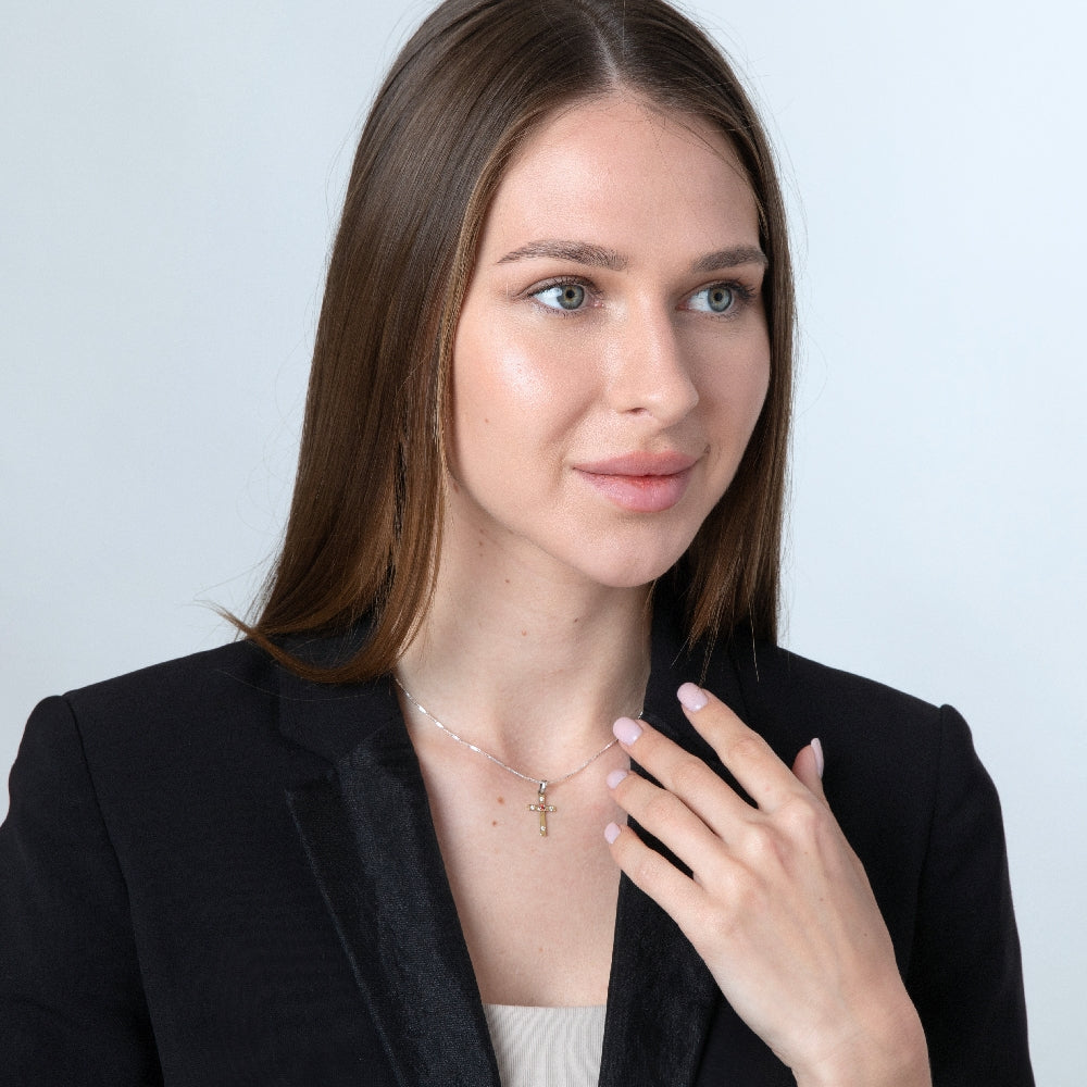 Cross Pendant Necklace in 925 Sterling Silver, Gold Plated with Garnet-Red and Clear Cubic Zirconia – shown worn