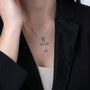 Bound Cross Pendant Necklace in 925 Sterling Silver – shown worn, close-up