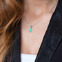 Blue Opal Cross Pendant Necklace, Silver Bezel Frame, 925 Sterling Silver – shown worn, close-up