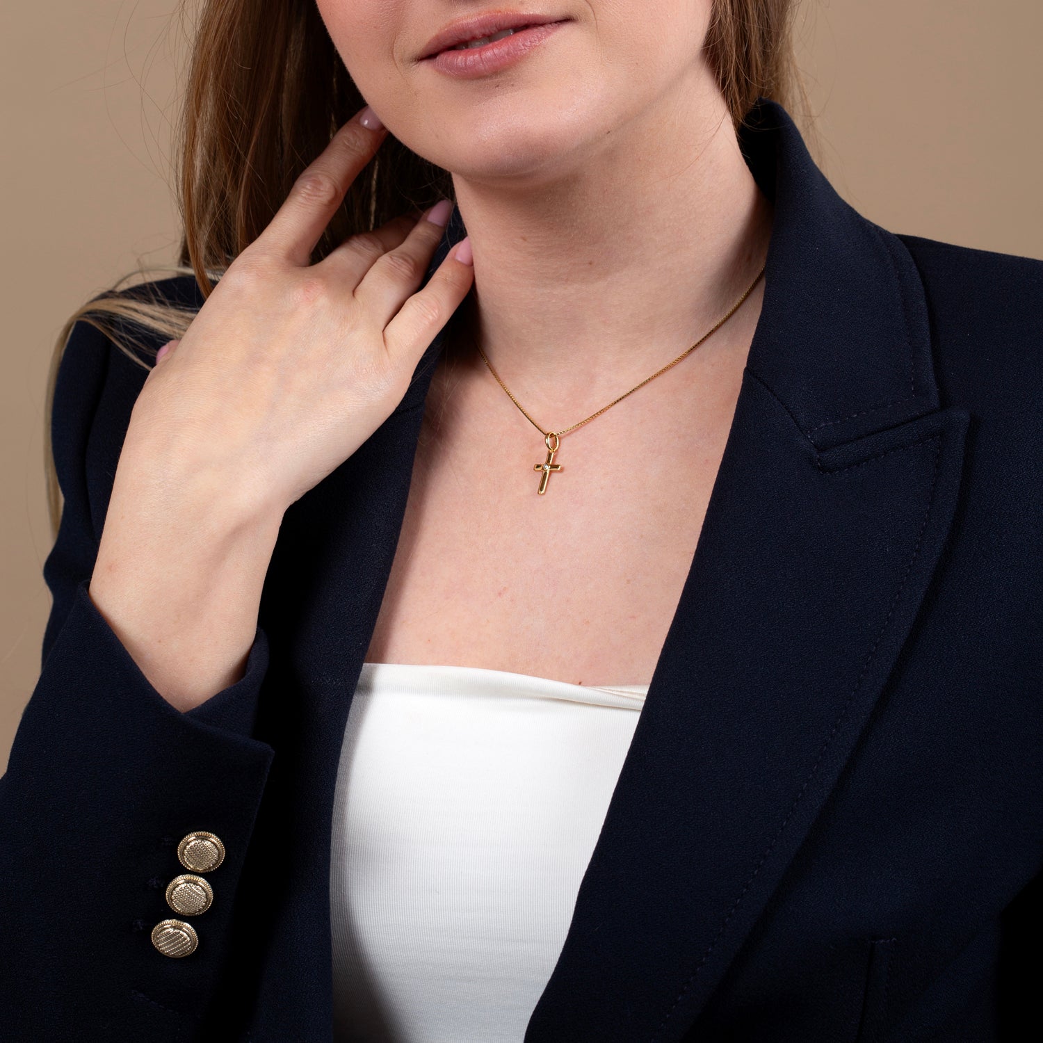 Cross “God Bless You” Gold CZ Pendant Necklace in Gold-Plated 925 Sterling Silver – shown worn, close-up