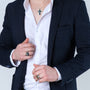Gold-plated Jerusalem Cross Eilat Stone signet ring in 925 sterling silver worn with a blazer, styled with a second ring
