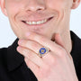 Jerusalem Cross ring with blue enamel and 14K gold-plated cross in 925 sterling silver on a man's hand, close-up