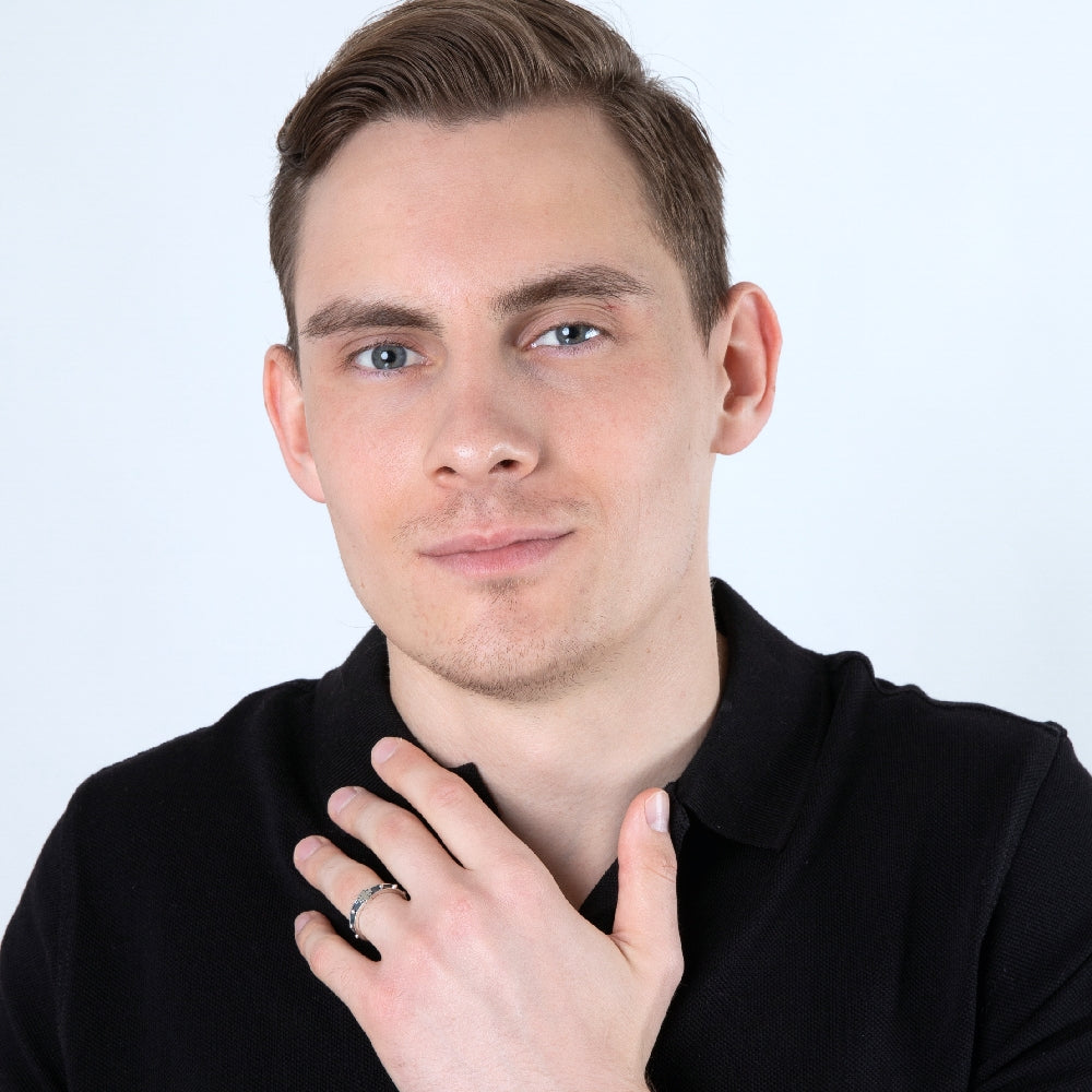 Man wearing the sterling silver Jerusalem Cross rosary ring