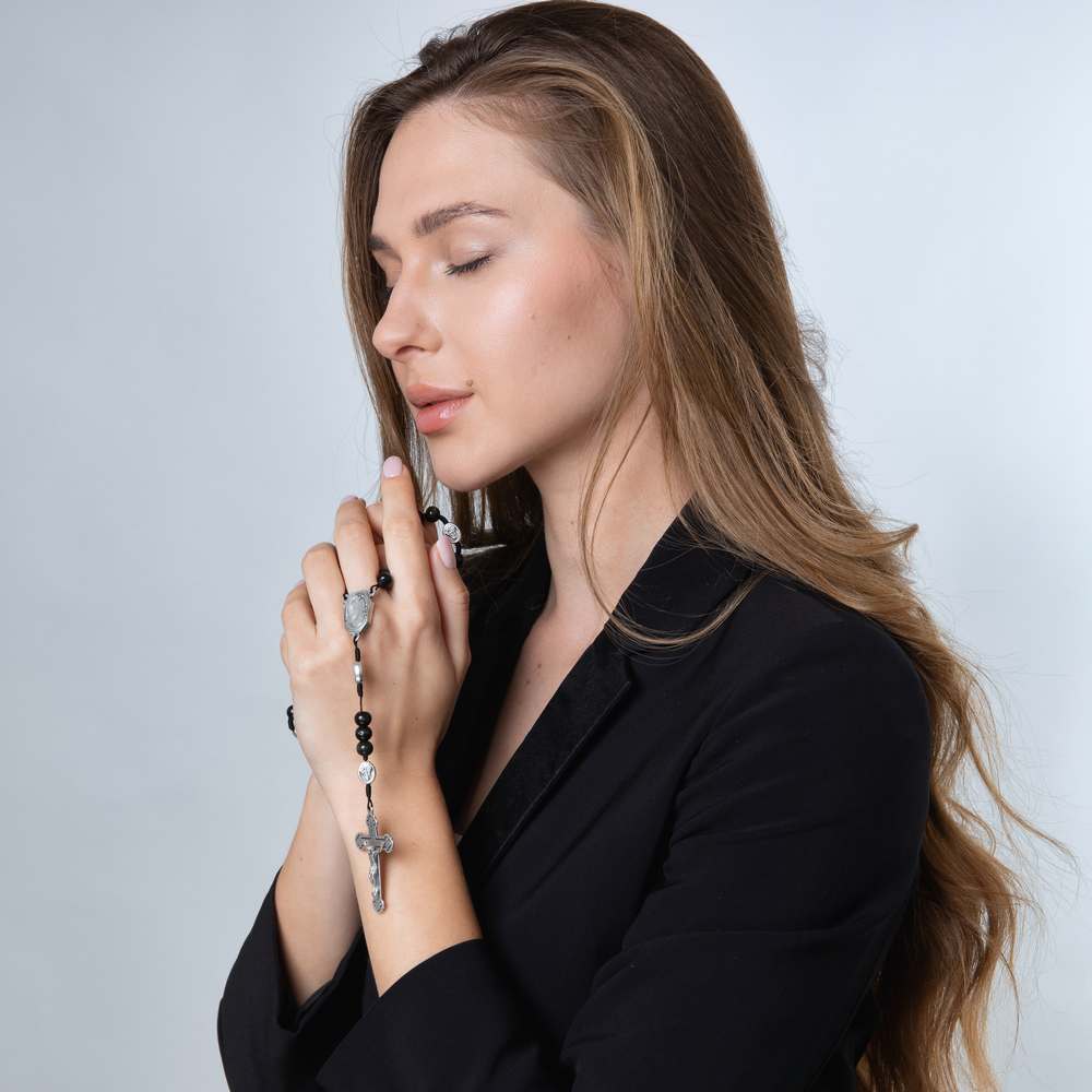 Black Wood Rosary with Jordan River Water & Crucifix – shown worn