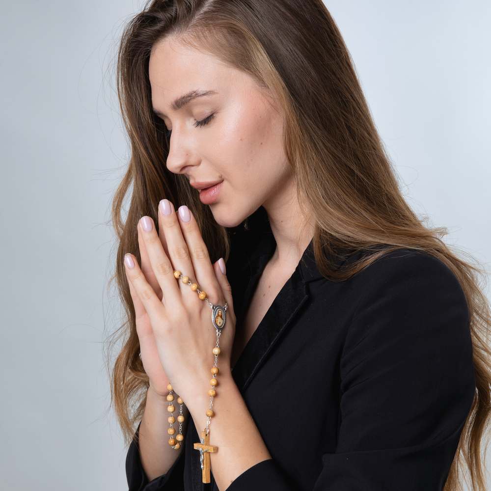Olive Wood Rosary with Sacred Heart Medallion and Crucifix – shown worn