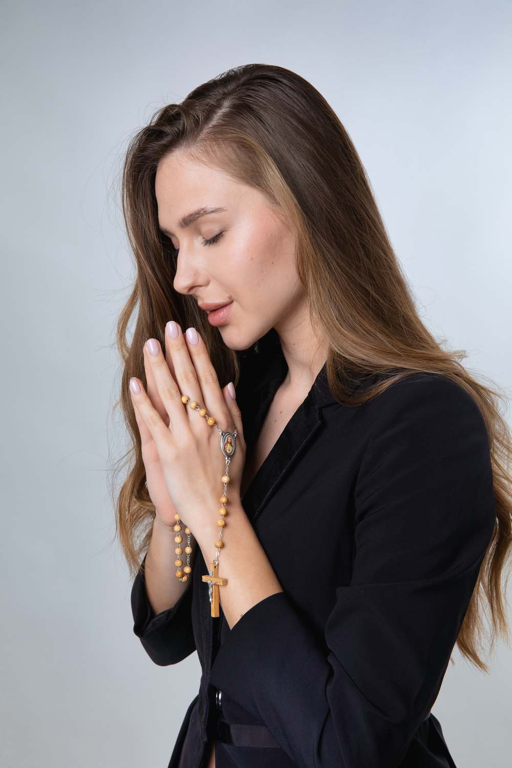 Olive Wood Rosary with Sacred Heart Medallion and Crucifix – shown worn